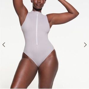 NWT Skims zip front sleeveless one piece in chrome
